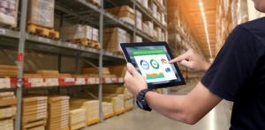 Man holding tablet in warehouse